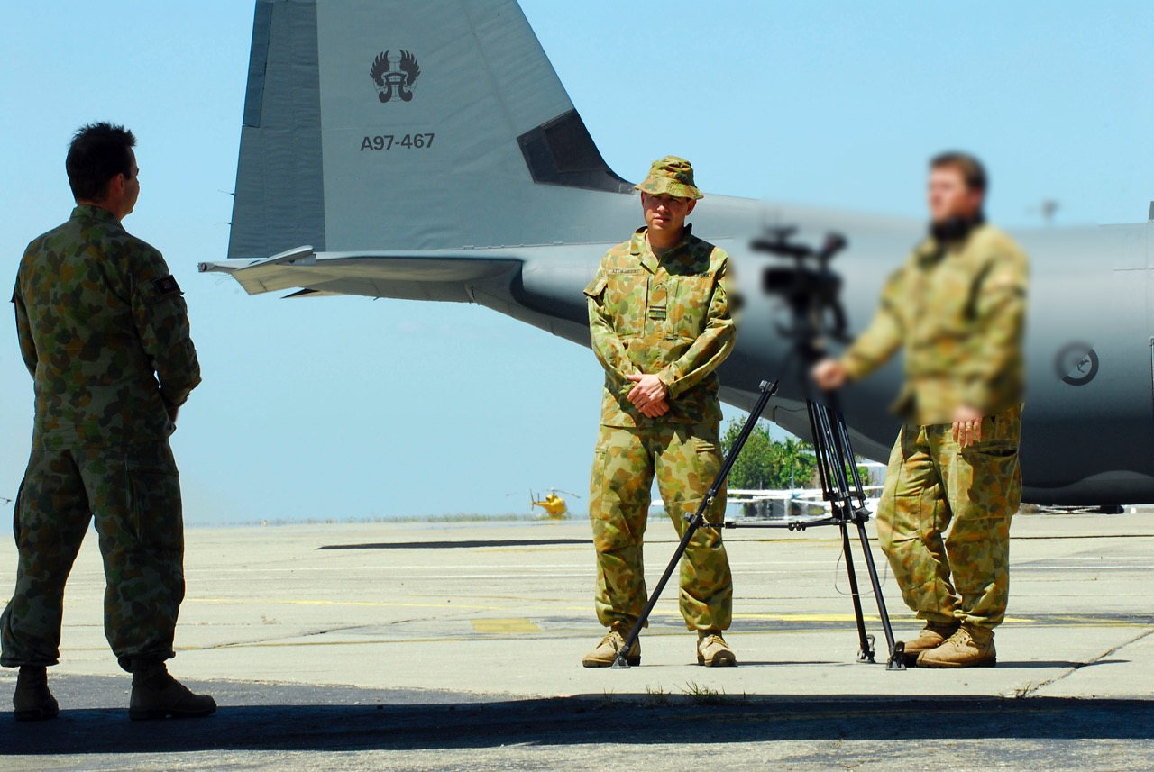 Martin Alderette being interviewed beside an Australian military aircraft